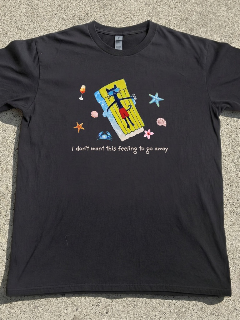 Black Graphic Tee with Colorful Beach Float Illustration